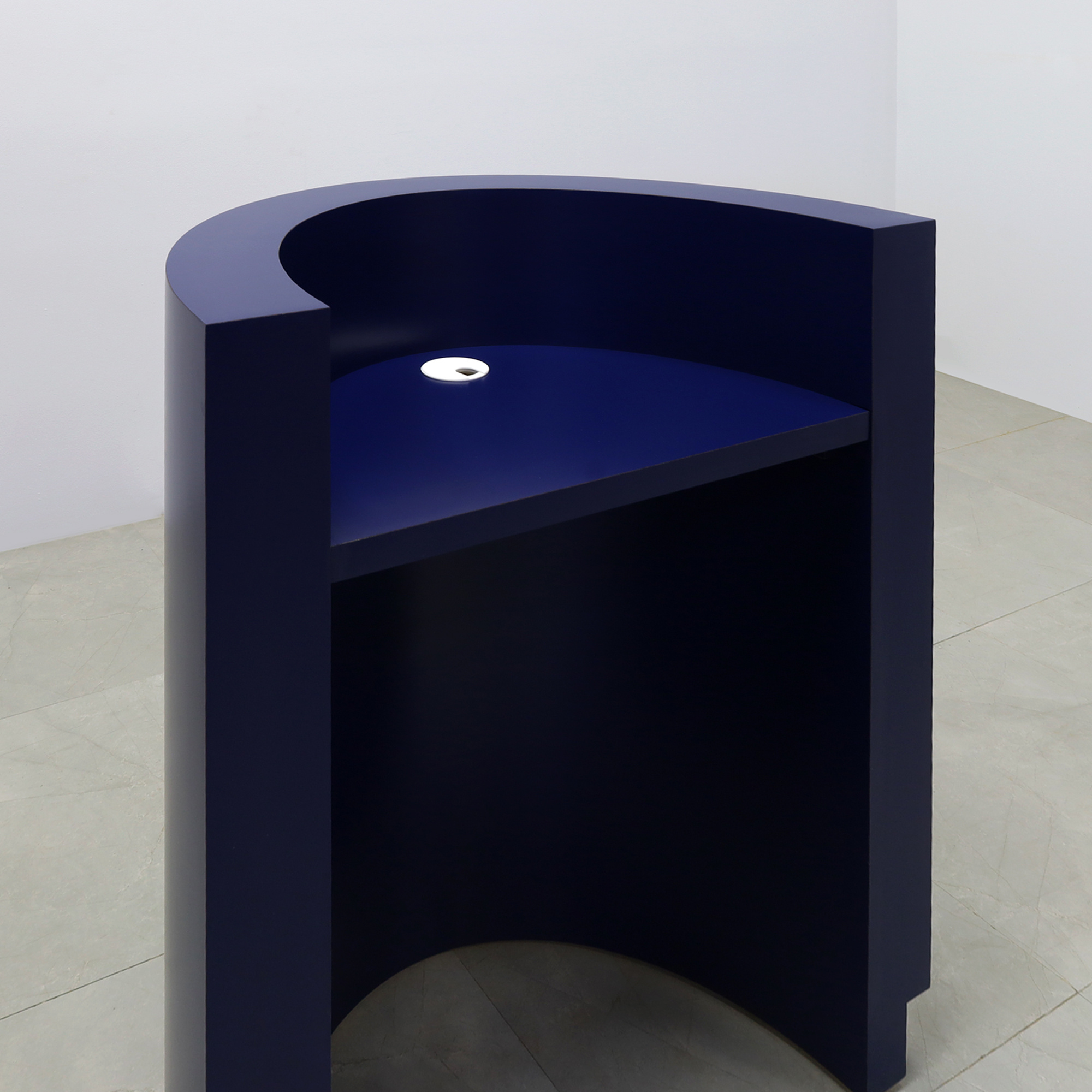32-inch Lima Round Podium & Host Custom Desk in navy blue matte laminate desk and toe-kick, shown here.