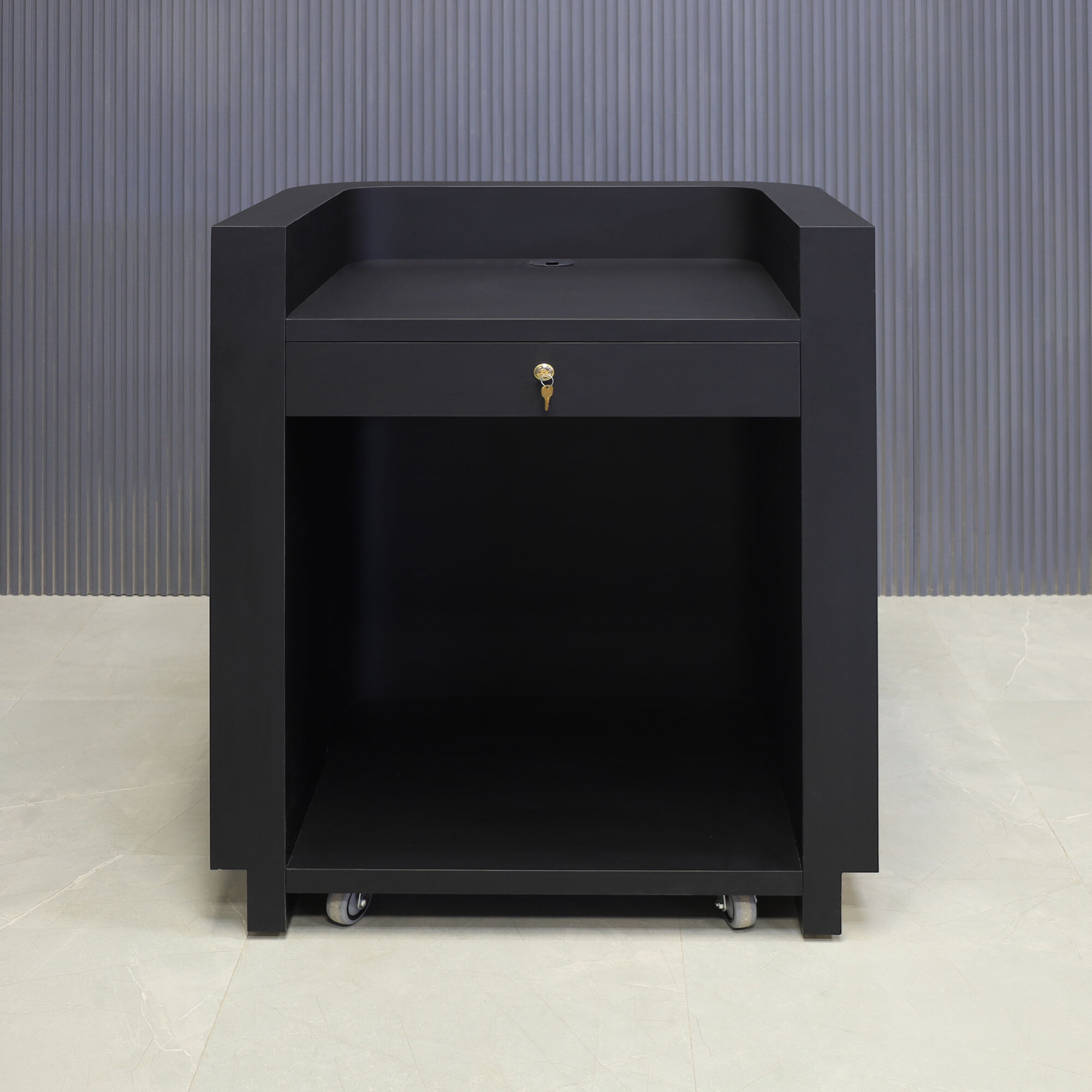 36-inch Nola Podium & Host in black traceless laminate main desk and brushed gold toe-kick, shown here.