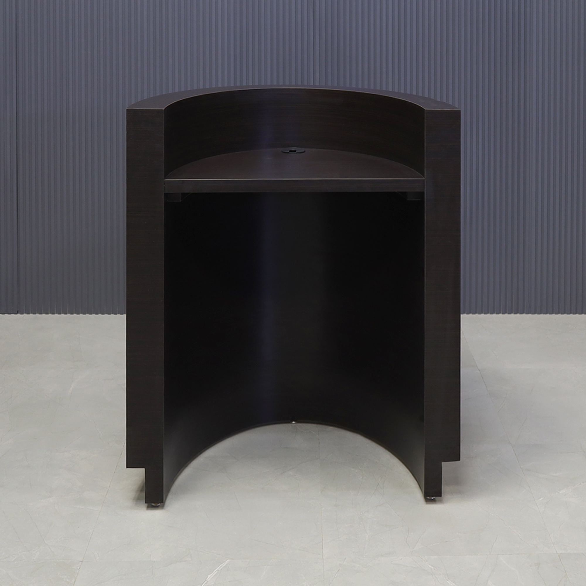 32-inch Lima Round Podium & Host Custom Desk in ebony recon matte laminate desk and gold aluminum toe-kick, shown here.